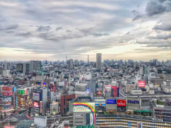 High angle view of buildings in city against sky