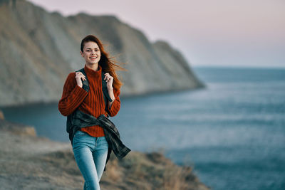 Full length of young woman on beach