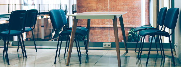 Empty chairs and table in cafe