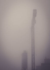 Smoke stacks in foggy weather
