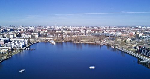 High angle view of cityscape against blue sky