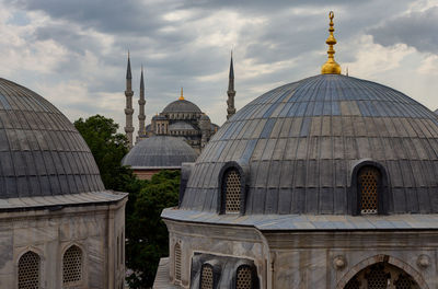 Blue mosque against cloudy sky