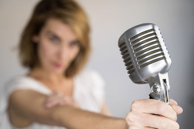 Portrait of woman holding camera