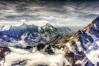 Scenic view of snowcapped mountains against sky