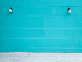 High angle view of green ball against blue wall