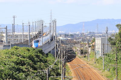 Train on railroad track against sky