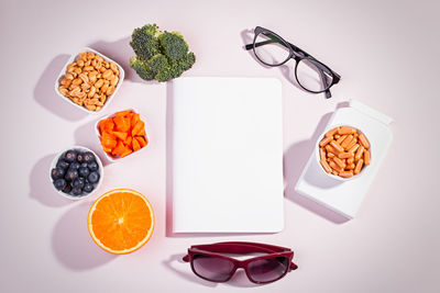 High angle view of fruits and table against white background