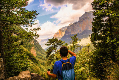 Rear view of teenager hiking at ordesa y monte perdido national park