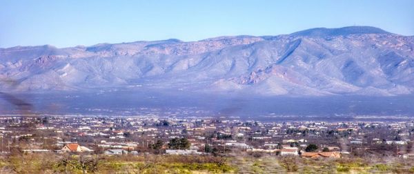 Cityscape with mountain range in background