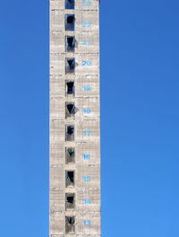 Low angle view of building against blue sky