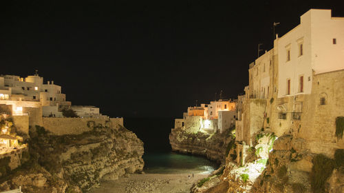 Buildings in city at night