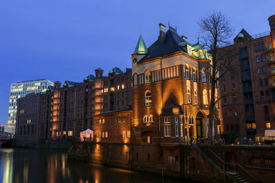 Illuminated buildings in city at night