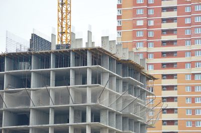 Low angle view of modern buildings against sky