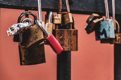 Close-up of padlocks hanging on railing