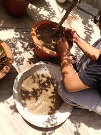 High angle view of man preparing food on table