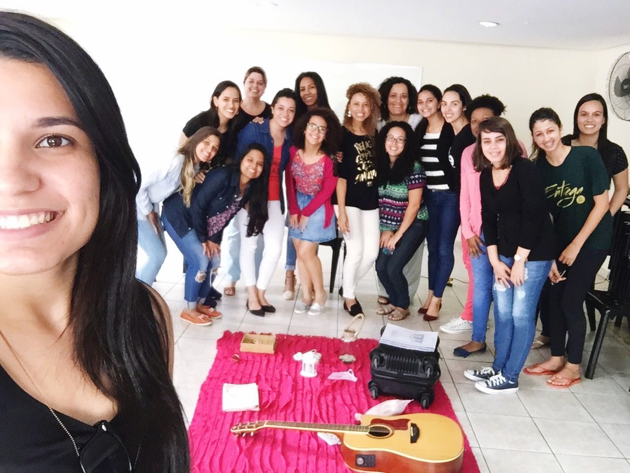 young women, large group of people, looking at camera, young adult, standing, people, cheerful, friendship, portrait, adults only, smiling, adult, group of people, women, togetherness, indoors, electric guitar, performance group, white background, day, fame