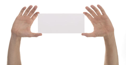 Low angle view of woman hand against white background