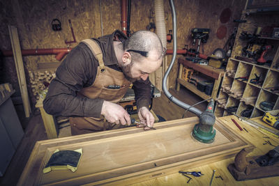 Man working on wood