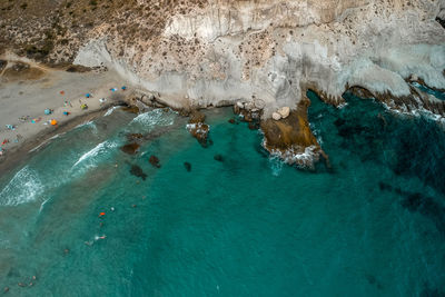 High angle view of people swimming in sea