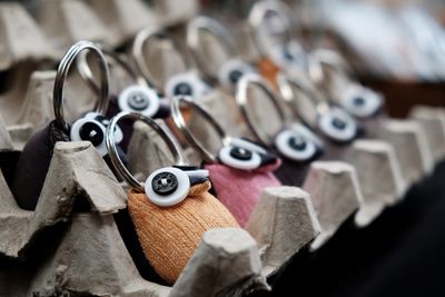 Close-up of key rings for sale in store