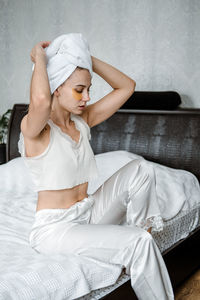 Self care, beauty, skin routine, everyday skin care and wellness. young woman in pajamas, towel 