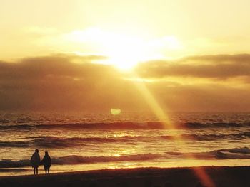 Silhouette of people on beach