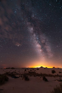 Scenic view of mountains against sky at night