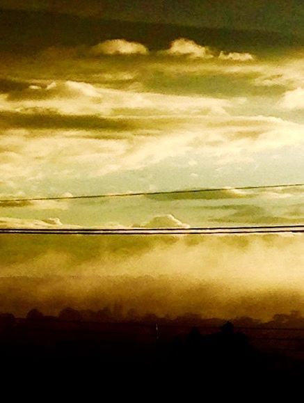 sky, power line, cloud - sky, cable, electricity, cloudy, tranquility, power supply, tranquil scene, scenics, connection, beauty in nature, sunset, low angle view, nature, cloud, weather, power cable, overcast, no people, idyllic, outdoors, landscape, dark