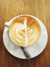 High angle view of cappuccino on table