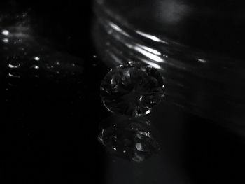 Close-up of water drop on glass