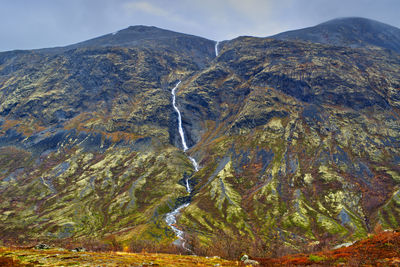 A waterfall from top to toe in jotunheimen national park .
