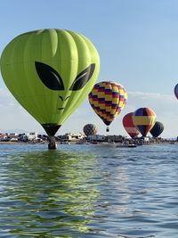 Close-up of colorful balloons against sky