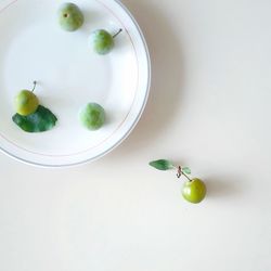 High angle view of fruits in plate on table