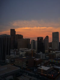 High angle view of buildings in city against sky during sunset