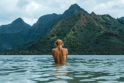 Full length of shirtless man in water