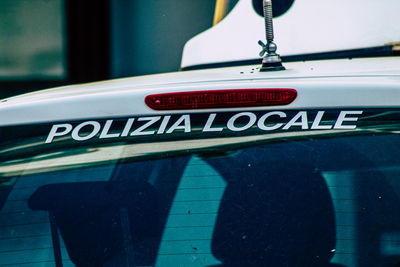 Close-up of information sign on car