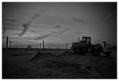 Lifeguard hut on beach against sky