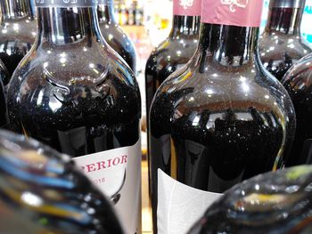 Close-up of wine bottles on table