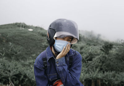 Portrait of boy wearing sunglasses on field