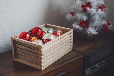 Vintage christmas ornaments, antique retro christmas glass baubles, balls in wooden box on 