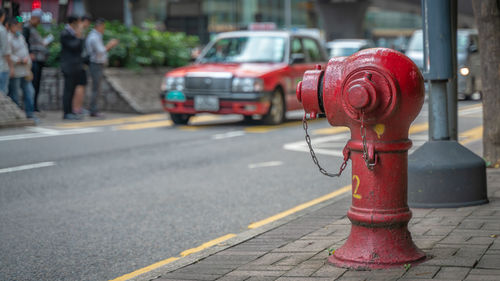 Red fire hydrant on street in city