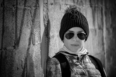 Portrait of boy wearing hat against wall