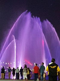 Panoramic view of people at night