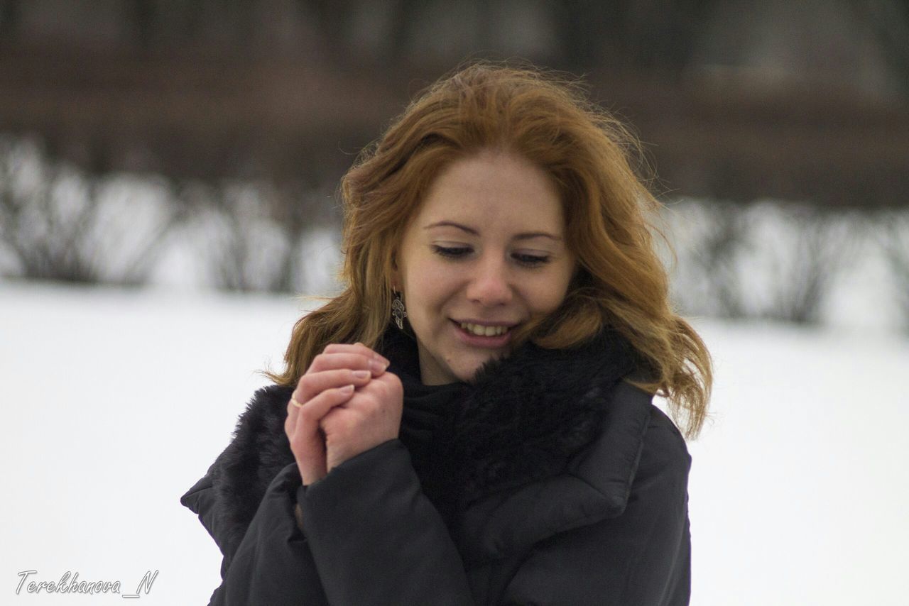 portrait, looking at camera, lifestyles, person, front view, waist up, focus on foreground, young adult, casual clothing, smiling, leisure activity, headshot, standing, happiness, young women, warm clothing, head and shoulders, jacket