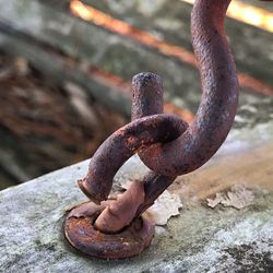 Close-up of rusty chain on rock