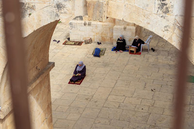 High angle view of people walking in historic building