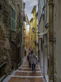 Rear view of woman walking on street