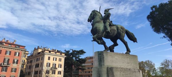 Low angle view of statue against sky