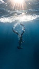 Person swimming in sea