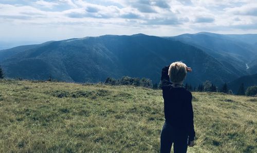 Rear view of man looking at mountain